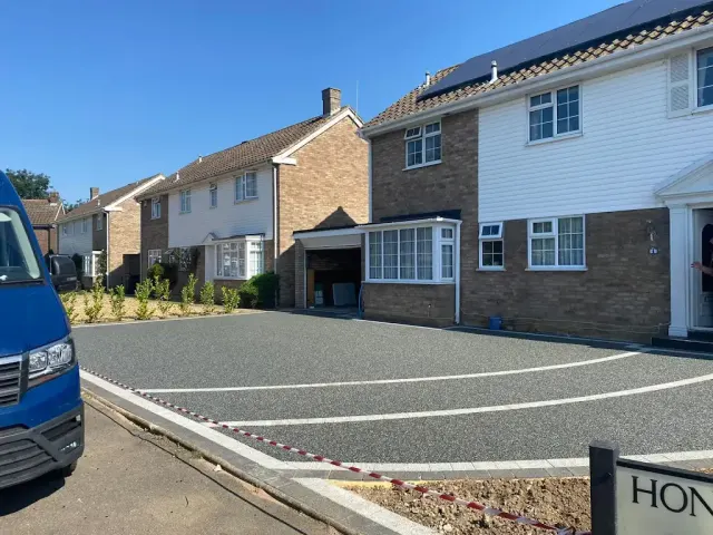 Large charcoal resin driveway serving two adjoining houses